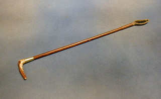 A childs riding crop with stag horn handle