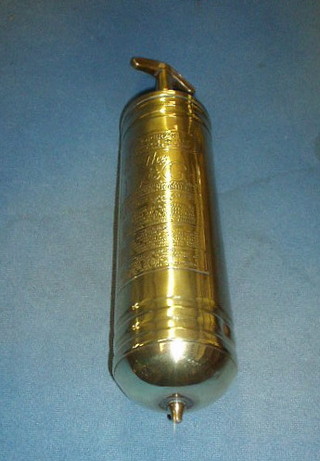 A brass L & G fire extinguisher