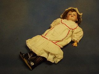 An Armand Marseille porcelain headed doll with open and shutting eyes, open mouth with teeth, the head marked Made in Germany Armand Marseille 390N A2M