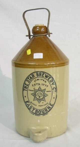 A stoneware flagon with iron handle and spicket marked The Star Brewery Company Eastbourne