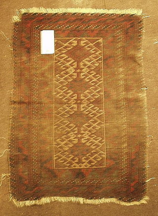 A Belouch slip rug 31" x 22" (in wear)