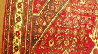 A  contemporary red ground Persian Hamadan carpet 120" x 85"