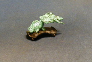 A verdigris figure of a fish 2"