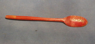 A Victorian wooden spoon, dated 1892