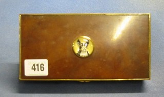 A brass and tortoiseshell effect cigarette box, the lid decorated a bulls eye panel depicting a boxer dog's head 7"