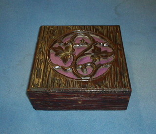 A carved oak box with hinged lid and pierced decoration