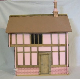 A Tudor style half timber dolls house