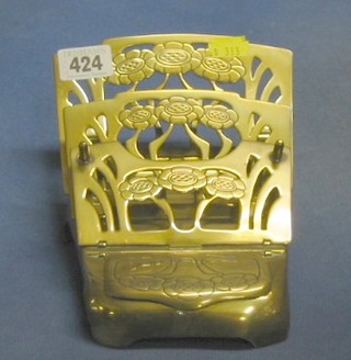 A pierced and engraved pierced brass Art Nouveau 3 tier letter rack, the base incorporating an inkwell