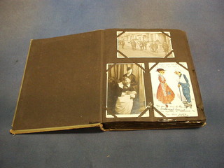 A postcard album containing various WWI black and white and colour postcards