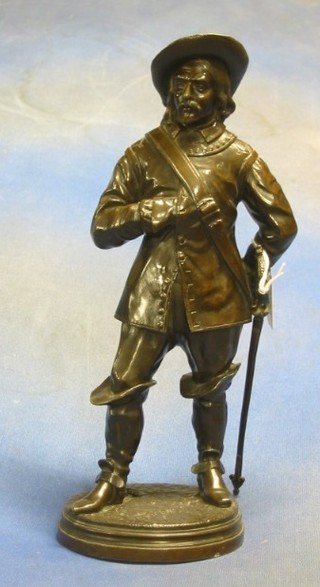 A bronze figure of a standing Cavalier 13"