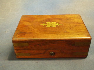 A Victorian rosewood and brass banded writing box with hinged lid and fitted interior 11"