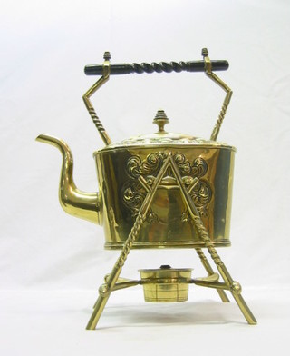 A 19th Century rectangular brass tea kettle, raised on crab stock supports