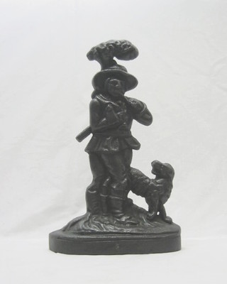 A 19th Century cast iron door stop in the form of a woodsman