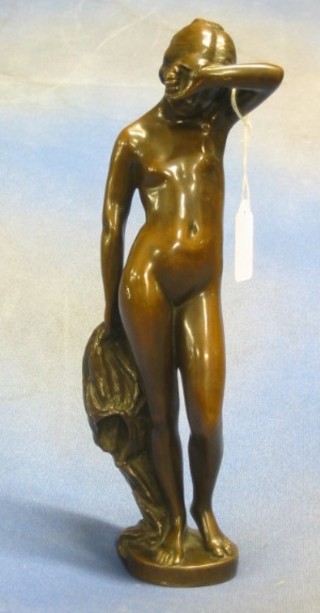 St.Cauer, 19th Century cast bronze figure of a standing lady, raised on a circular base, 12"