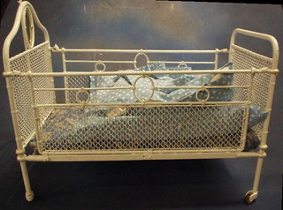 A childs iron and mesh cot 26"