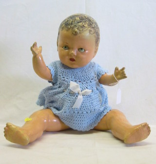 A childs doll the head marked Reliable