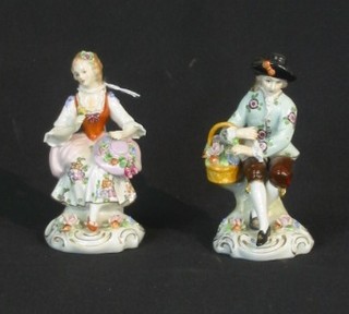 A pair of 19th/20th Century porcelain figures of a seated boy and girl 5"