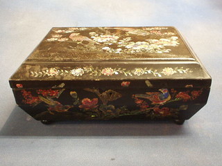 An Oriental lacquered box with hinged lid