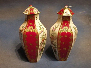 A pair of Samson vases with red and gilt panel decoration decorated birds amidst flowering branches