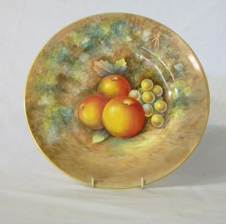 A modern Royal Worcester circular plate decorated peaches and grapes, signed Hook, base with black Royal Worcester mark 10 1/2"