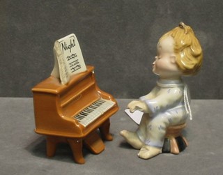 A Beswick figure of a girl playing a piano "Good Night" (af)