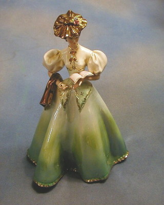 An Italian pottery figure of a standing lady with book and scroll, 13"