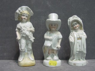 A 19th Century German porcelain figure of a girl with glasses 6", another girl with top hat and 1 other figure