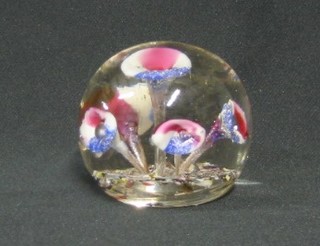 A glass paperweight decorated flowers 3"