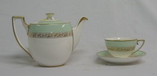 A Wedgwood 18 piece tea service with duck egg green borders and gilt banding, the base marked BB3521 H4567 comprising twin handled bread plate, 5 tea plates, teapot (cracked), cream jug, 5 cups and saucers