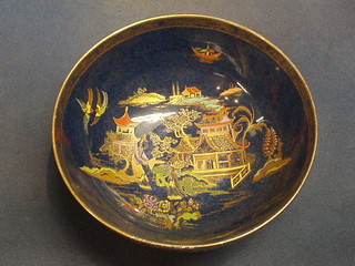 A circular Carltonware blue lustre bowl with chinoiserie decoration 9"