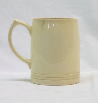 A Wedgwood white glazed Keith Murray tankard