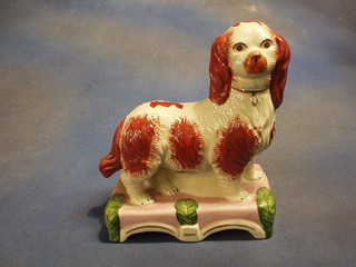 A reproduction Staffordshire figure of a standing Spaniel 10"