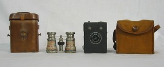 A pair of opera glasses and a Popular Brownie box camera