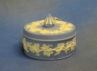 A circular Wedgwood blue Jasperware jar and cover, base marked 77 5"