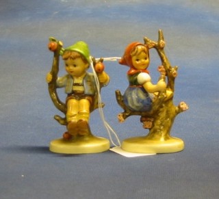 A Hummel figure of a girl sitting on a tree and another seated boy 3"