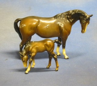 A Beswick figure of a bay  horse (ear f), 5" and a Beswick figure of a bay foal 3"