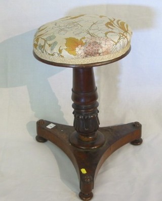 A William IV mahogany adjustable piano stool on a carved column and triform base (f)