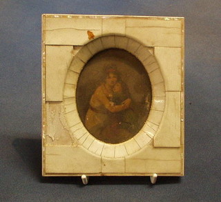 A 19th Century over enhanced portrait print contained in a ivory frame 4" oval