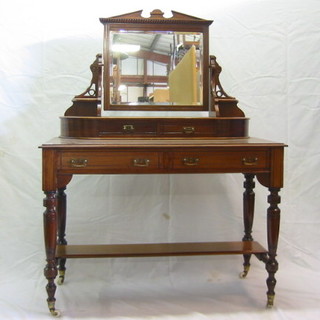 An Edwardian mahogany dressing table fitted a mirror above 2 glove drawers, the base fitted 2 long drawers on turned supports 42"