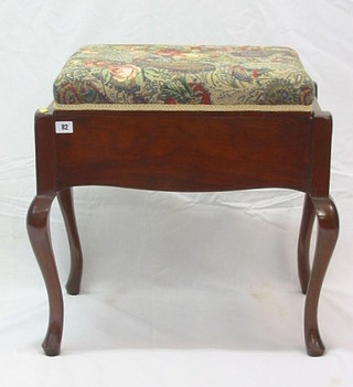 An Art Nouveau mahogany box seat piano stool with hinged lid, raised on cabriole supports 22"