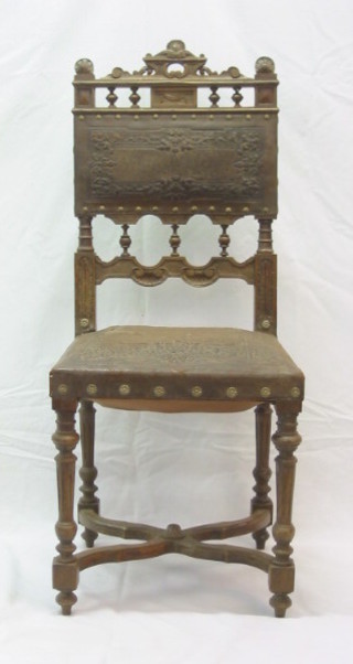 A set of 5 19th Century French oak Carolean style dining chairs, the seats and backs upholstered in leather, on turned and fluted supports on X framed stretchers