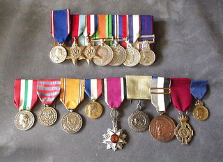 A group  of 16 medals to Henry Edward Harrison comprising: Queen Elizabeth II Royal Victoria medal silver, 1939-45 Star, France and Germany Star, Defence War medal named to 315586 C A Edwards, 1977 Jubilee medal, Queen Elizabeth II Royal Household Faithful Service medal with 30 year bar, all court mounted.   9 various foreign decorations: 5th Class, Jordanian Order of Independence, Shar Homayoun of Iran medal, Republic of Liberia Gold medal of Honour, Hellenes Royal Order of George I Gold, The Netherlands Silver medal of Honour Order of the Crown, Portuguese Decoration, The French Medaille d'honneur des Affaires Etrangers (Vermil), a Swedish decoration, Greek decoration, complete with all medal cases.  Various citations, wearing warrants and letters confirming appointment to Royal Household Faithful Service medal and letters of congratulations, together with a photograph of the recipient driving the Royal car.