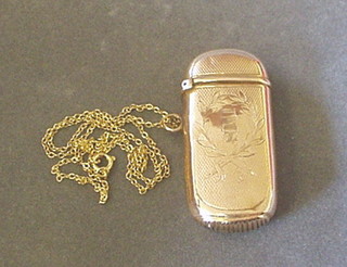 A gold vesta case, engraved IMS hung on a gold chain