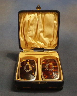 A pair of small military tortoiseshell and silver back hair brushes Birmingham 1927, cased