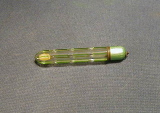A 1930's cut glass scent phial with green enamelled lid,