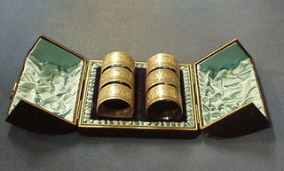 A set of 6 Edwardian engraved silver plated napkin rings, cased