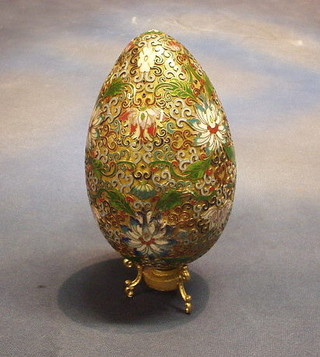 A champleve enamel ornament in the form of an egg 7" (some dents)