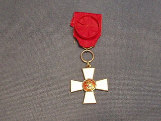 An enamelled breast badge of The Order of the Lion of Finland Civil Division hung a red ribbon