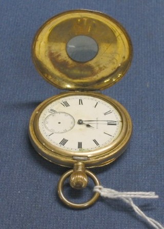 A Waltham demi-hunter pocket watch contained in a gold plated case