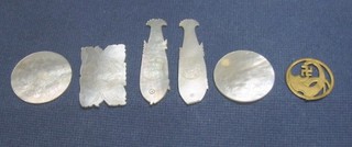 5 carved mother of pearl game counters and a pierced metal mount